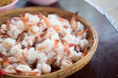 Boiled orange color of cooked shrimp in basketの写真素材