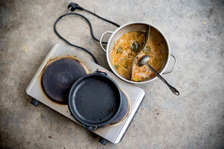 Hot Pot cuisine for Shabu Shabu have dirty after finished eating on floor in the restaurant.の写真素材