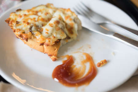 Bruschetta with mushrooms on white dish for a breakfastの写真素材