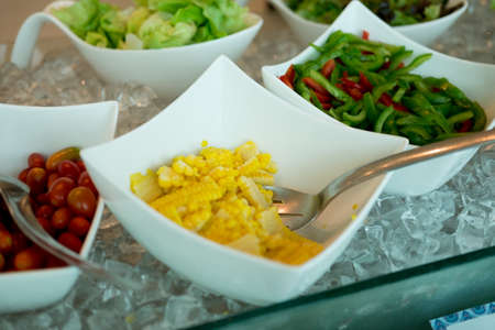 bar or restaurant with a choice of different types of fruit and vegetable salads