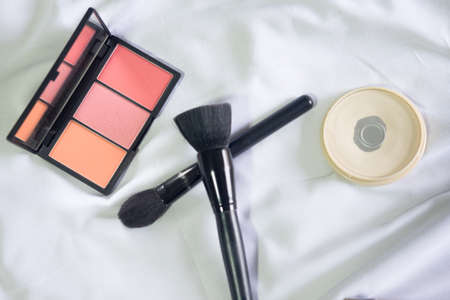 Face makeup cosmetics on white bed backgroundの写真素材