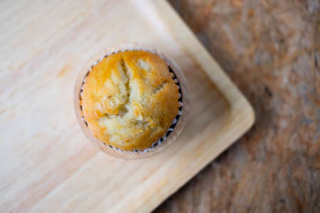 Banana cup cake sweet dessert bakery on wooden board.の写真素材