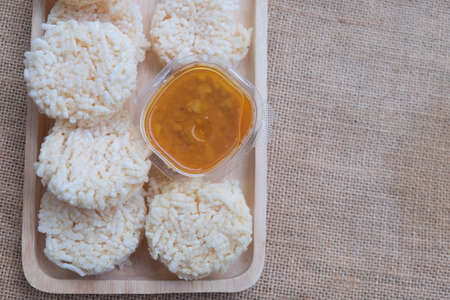 Thai dish dipping sauce with rice cracker on trayの写真素材
