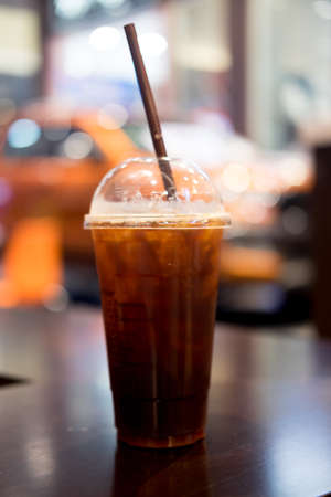 Ice black Coffee on the table in the cafe.