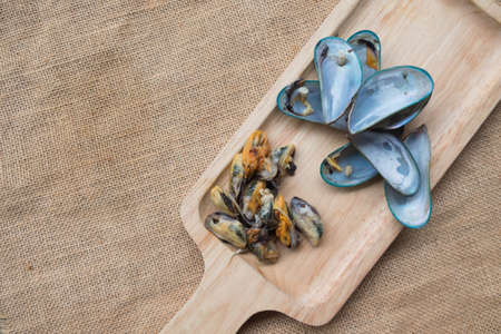 Thai Food steamed mussels on wood trayの写真素材