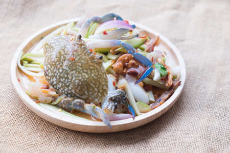 Spicy mango salad with blue crab, Thai popular foodの写真素材
