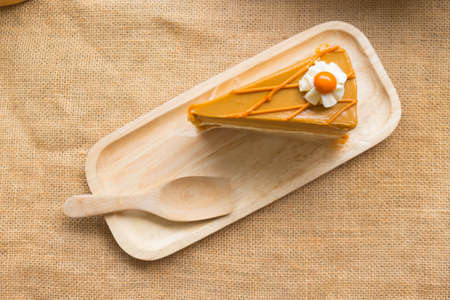 Milk Tea cake on wood tray, top view