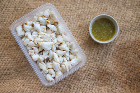 Steamed crab meat serve with seafood sauce in boxの写真素材