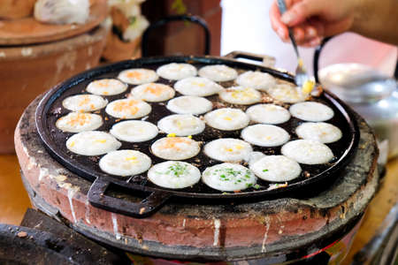 Coconut milk mix sugar and flour on hot Thai panの写真素材
