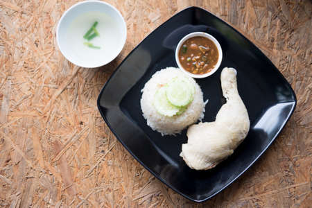 Hainanese chicken rice with soup and sauce, top view