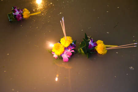 People float lanterns in the river to worship river goddess in Loy Kratong festival.の写真素材
