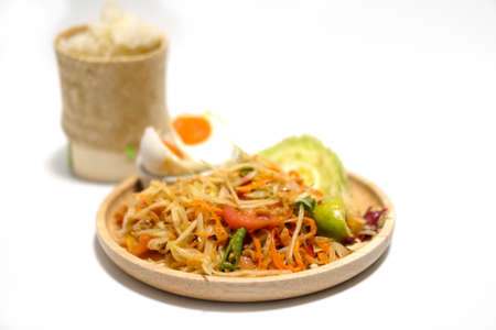 Papaya salad (som tum Thai) with sticky rice on white backgroundの写真素材