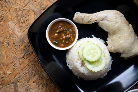 Rice steamed chicken soup with cucumber and sauce (hainanese chicken rice)の写真素材