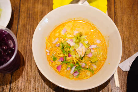 Curried Noodle Soup (Khao soi) with spicy coconut milk. Noodle Soup with beef. Curried noodle soup....