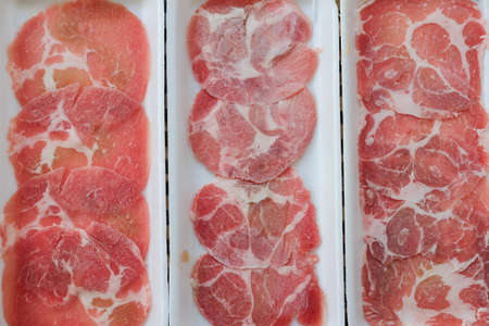 Slice pork meat on foam tray ready to cook