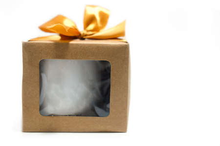 Gift box with gold ribbon on white backgroundの写真素材