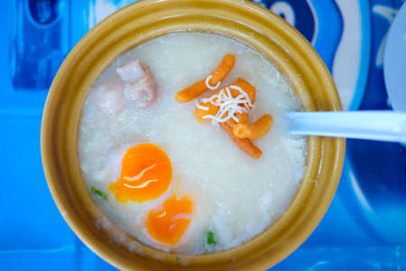 Rice porridge rice gruel congee rice soup with egg and pork