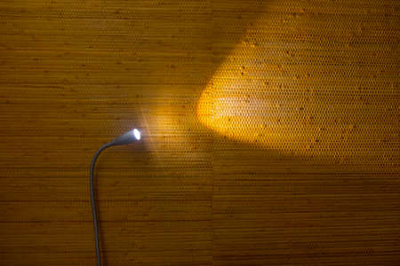 Close up lamps with warm light on a brown wall in the bedroomの写真素材