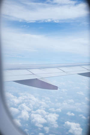 Blue sky and clouds view on plane, nature backgroundの写真素材