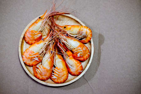 Boiled shrimp on wooden dish, Close upの写真素材