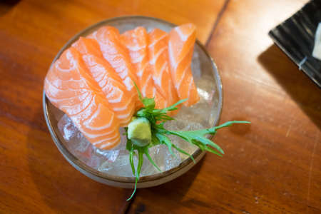 Japan raw salmon slice or salmon sashimi in Japanese style fresh serve on ice in Japanese restaurant.の写真素材
