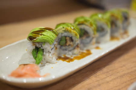 Tasty appetizing uramaki sushi roll (selective focus)の写真素材