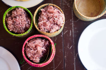 Cooked sticky rice-berry in bamboo basket, top viewの写真素材