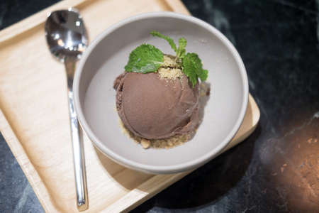 Scoops of ice cream chocolate in a bowl (tilted view)の写真素材