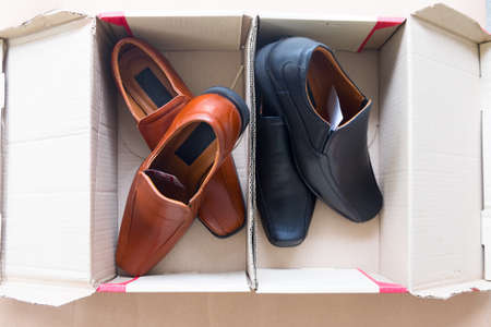 Classic shoes black and brown made of leather in the boxの写真素材