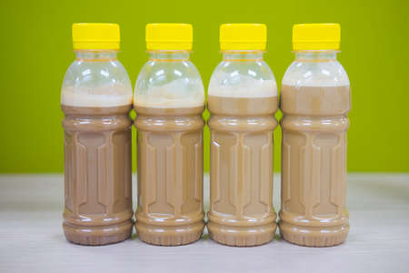 Four coffee in plastic bottle for take away