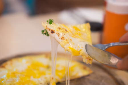 Close up of eating tasty pizzaの写真素材