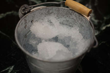Cold ice in a bucket, ready for partyの写真素材