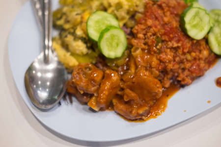 Close up rice topped with Thailand food on blue dish