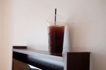 Ice black coffee in tall plastic glassの写真素材