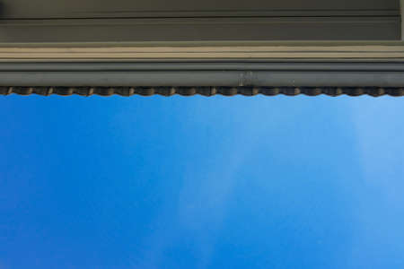 The roof under a blue cloudy sky background
