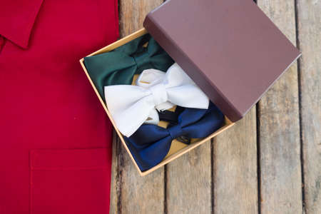 Wedding accessories. groom and groomsmen bow tie in paper box