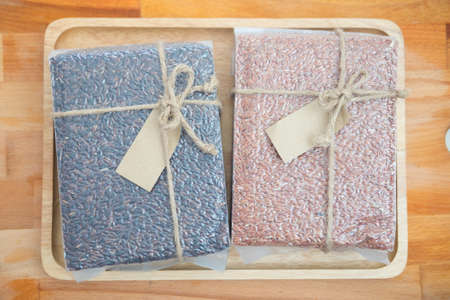 Riceberry and brown Jasmine rice in plastic bag - concept healthy foodの写真素材
