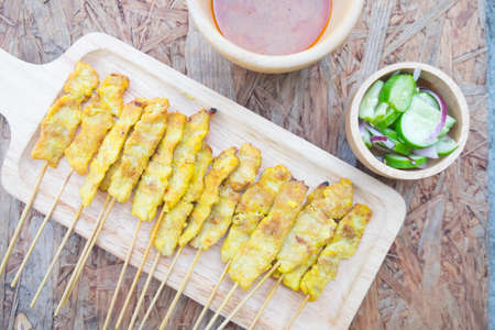 Grilled pork satay with peanut sauce, Traditional Thai barbecue roasted pork.の写真素材