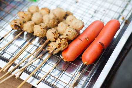 Grilled meat ball and hotdogs in Thailand night streetの写真素材