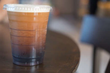 Iced black coffee for refreshing on wood tableの写真素材