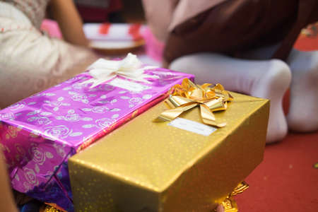 Two gift box with bride and groom background (pink and gold)の写真素材