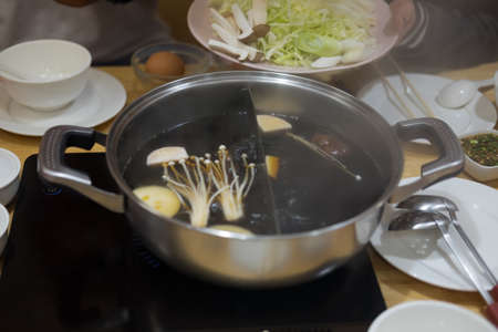Vegetables are cooked in a hot pot Sukiyaki. (healthy food)