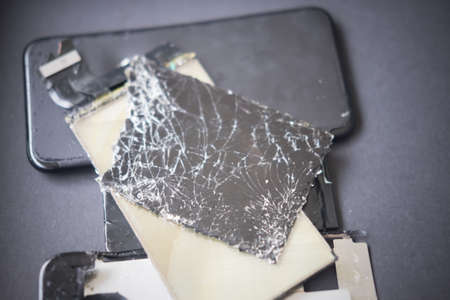 Damaged smartphone, Phone screen broken in cracks.の写真素材