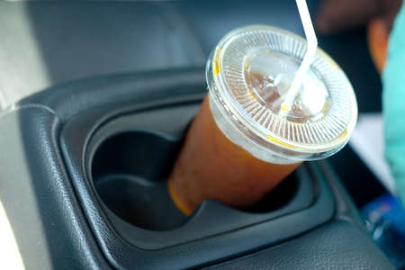 Ice black coffee in the personal carの写真素材