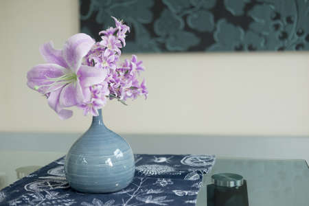 Artificial flower in the vase decoration on table dinnerの写真素材