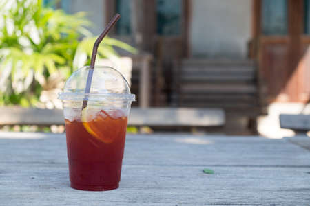 Ice lemon tea on wood table - selective focusの写真素材