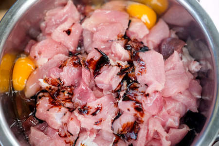 Raw pork with fermented sauce and egg yolk for grilledの写真素材