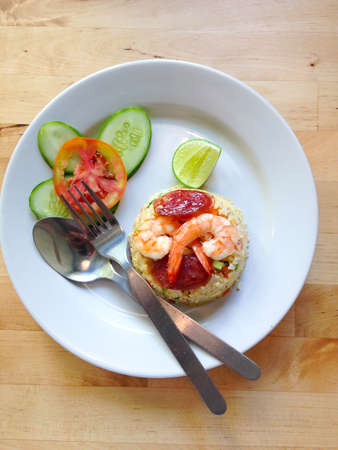 Fried rice with shrimp in a white dish in thai food styleの写真素材