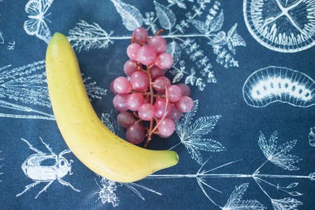 Colorful artificial fruits for interior decoration (Banana and Grape)の写真素材