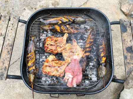 Grilling at summer weekend. Fresh meat, fresh chicken and catfish on grill.